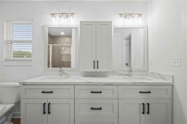 3903 NW 93rd St, Kansas City, MO 64154 - full bath featuring a sink, toilet, a stall shower, and double vanity