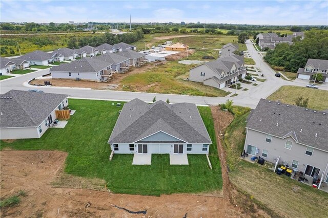 3903 NW 93rd St, Kansas City, MO 64154 - drone / aerial view with a residential view
