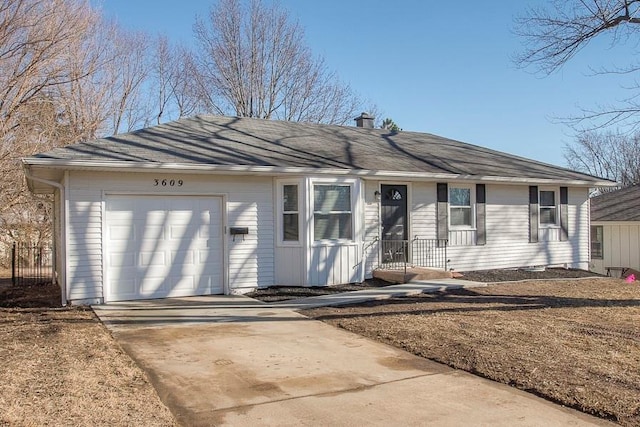 ranch-style house featuring concrete driveway, an attached garage, and a chimney