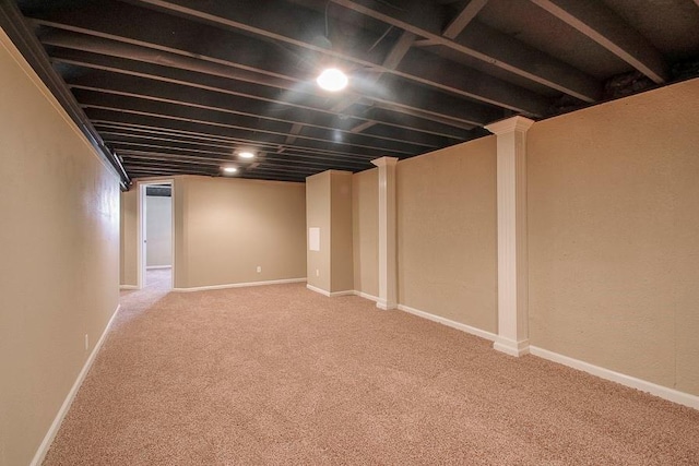 finished basement featuring carpet flooring and baseboards