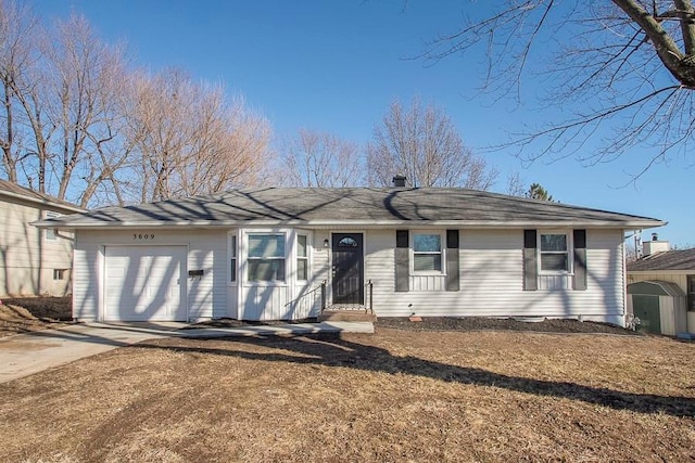 ranch-style house featuring concrete driveway