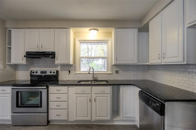 kitchen with a sink, under cabinet range hood, appliances with stainless steel finishes, white cabinetry, and backsplash