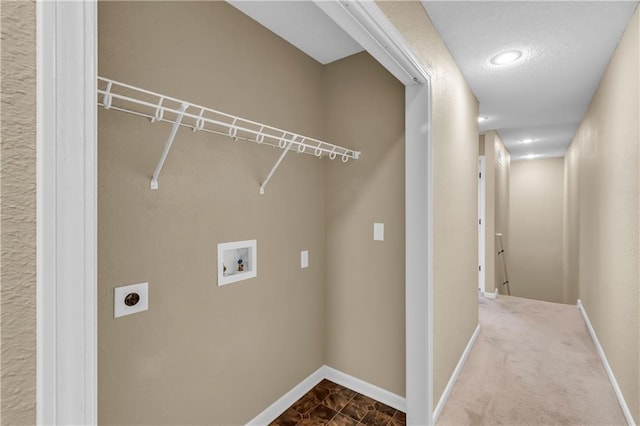 clothes washing area with washer hookup, laundry area, baseboards, and electric dryer hookup