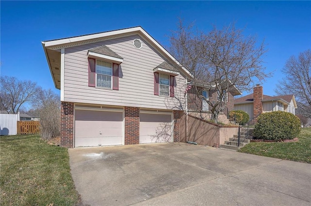 view of front of home featuring stairway, concrete driveway, a front lawn, a garage, and brick siding