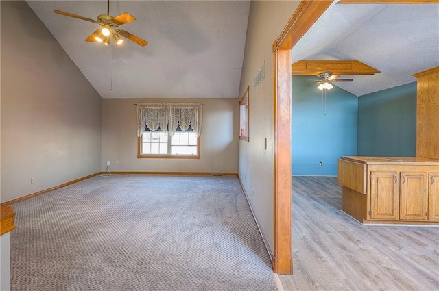 spare room featuring visible vents, baseboards, a textured ceiling, and a ceiling fan