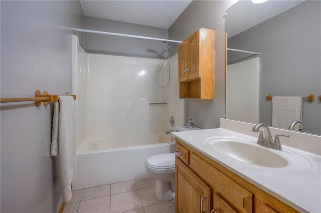 bathroom with shower / washtub combination, toilet, vanity, tile patterned floors, and a textured ceiling