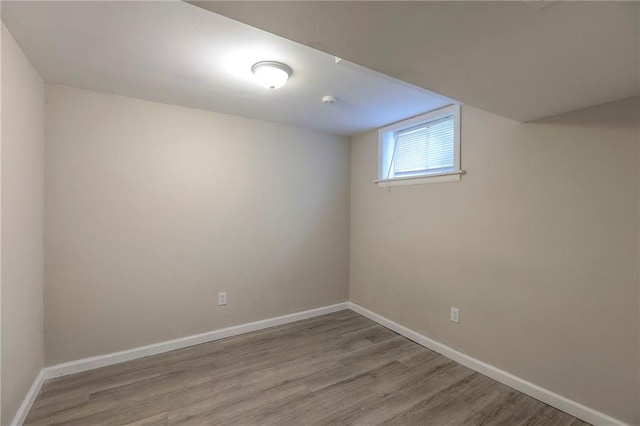 basement with wood finished floors and baseboards