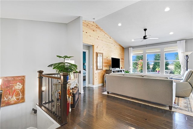 living area featuring wood finished floors, lofted ceiling, recessed lighting, ceiling fan, and wood walls