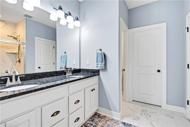 full bath with visible vents, marble finish floor, a marble finish shower, and a sink