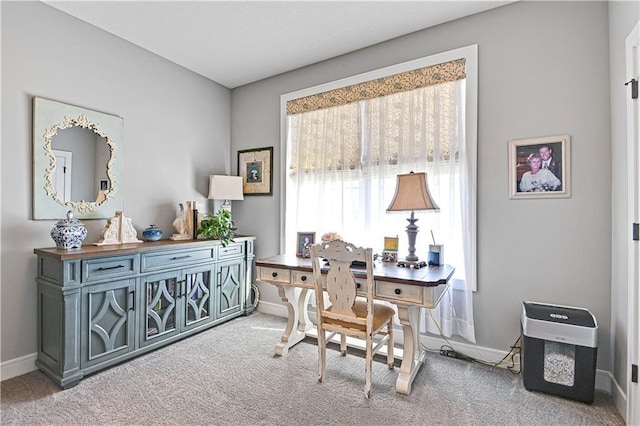 office area featuring baseboards and carpet floors