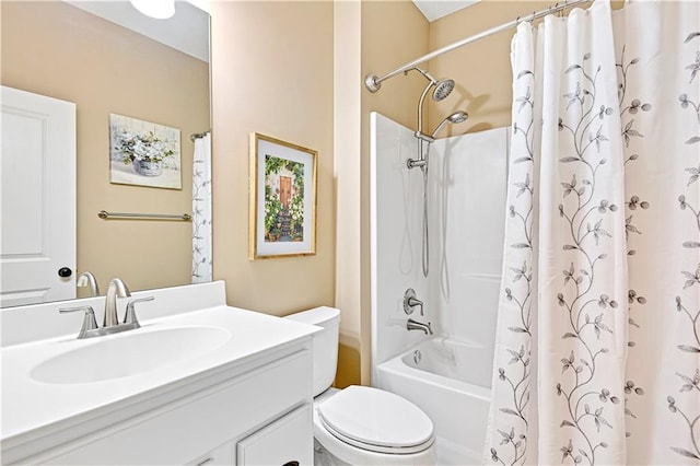 bathroom with shower / bath combo with shower curtain, toilet, and vanity