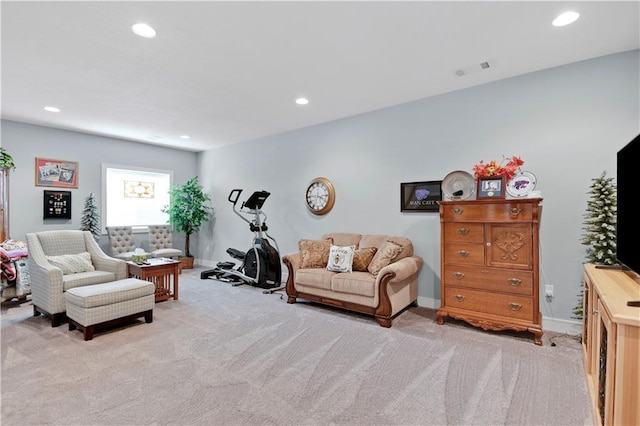 living room featuring recessed lighting, visible vents, baseboards, and light colored carpet