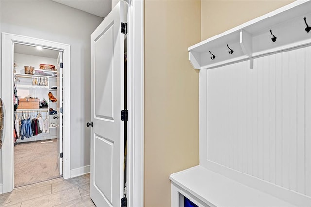 mudroom featuring light colored carpet