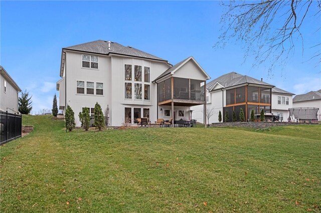 12745 N Larkspur Ln, Platte City, MO 64079 - rear view of property with a yard, a patio area, and a sunroom