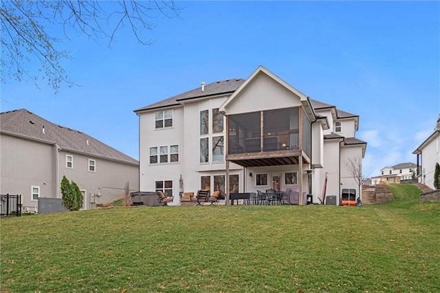 12745 N Larkspur Ln, Platte City, MO 64079 - back of house with a lawn, a sunroom, and a patio area