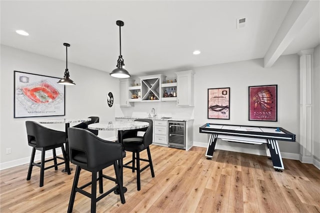 12745 N Larkspur Ln, Platte City, MO 64079 - dining space with wet bar, wine cooler, and baseboards