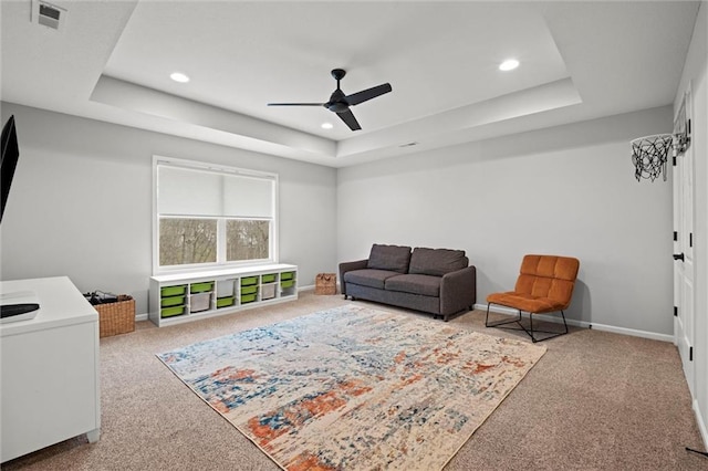 12745 N Larkspur Ln, Platte City, MO 64079 - carpeted living area with recessed lighting, a raised ceiling, visible vents, baseboards, and ceiling fan