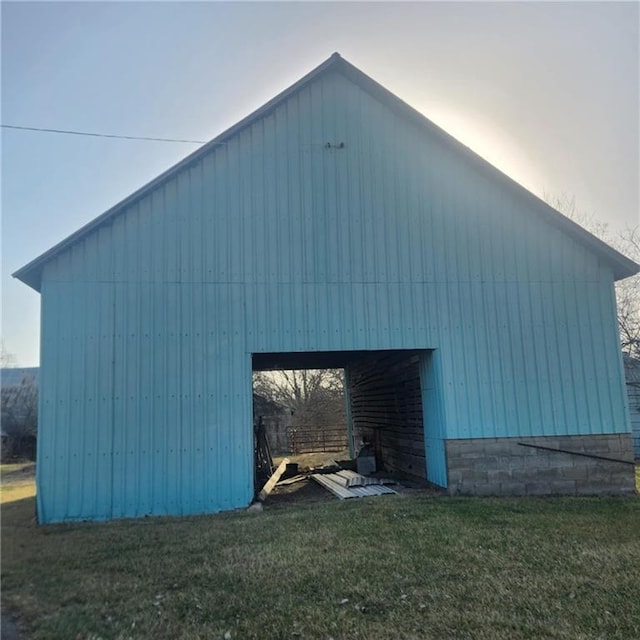 exterior space featuring a yard, an outbuilding, an outdoor structure, and a carport