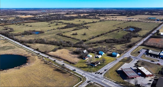 bird's eye view featuring a rural view and a water view