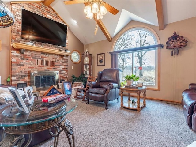 living area with beam ceiling, a ceiling fan, carpet, a fireplace, and baseboards