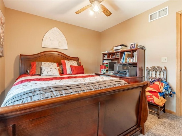 carpeted bedroom with visible vents and baseboards