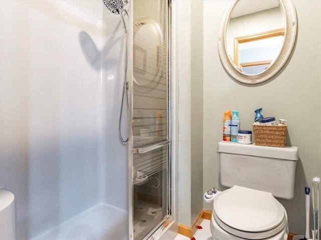 full bath with toilet and a stall shower