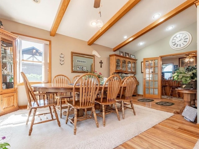 dining area featuring recessed lighting, lofted ceiling with beams, baseboards, and wood finished floors