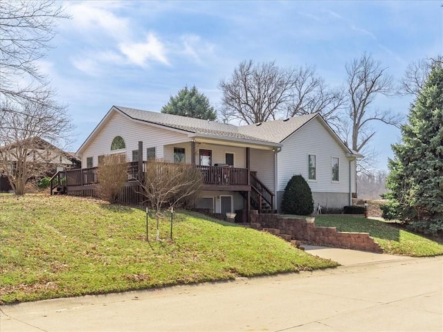 view of front of property featuring stairs, a front yard, and a wooden deck