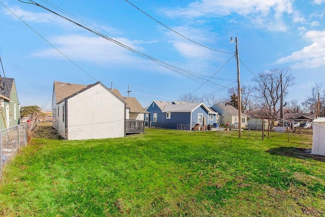 view of yard with a residential view and fence