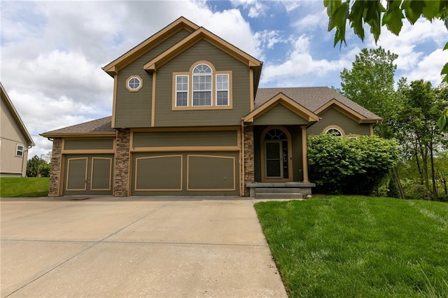 8755 N Chatham Ave, Kansas City, MO 64154 - view of front of house with a front yard, a garage, and concrete driveway