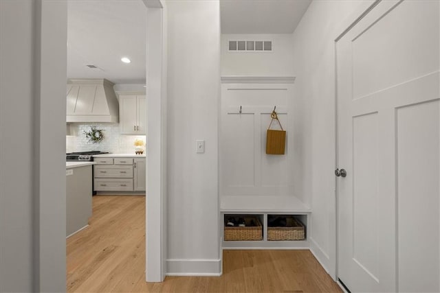 9010 N Denver Ave, Kansas City, MO 64156 - mudroom with recessed lighting, visible vents, baseboards, and light wood-style flooring