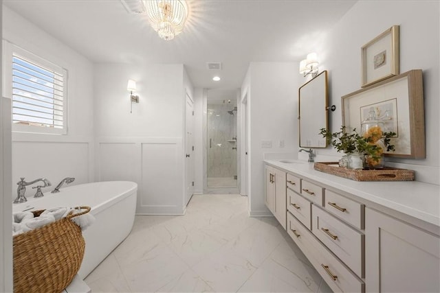 9010 N Denver Ave, Kansas City, MO 64156 - full bath with vanity, a wainscoted wall, marble finish floor, a freestanding bath, and a stall shower