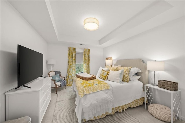 9010 N Denver Ave, Kansas City, MO 64156 - bedroom with a raised ceiling and light carpet