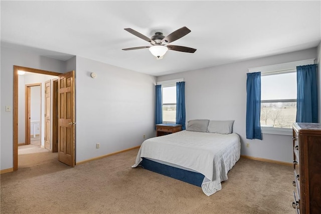 bedroom with baseboards, light carpet, and ceiling fan