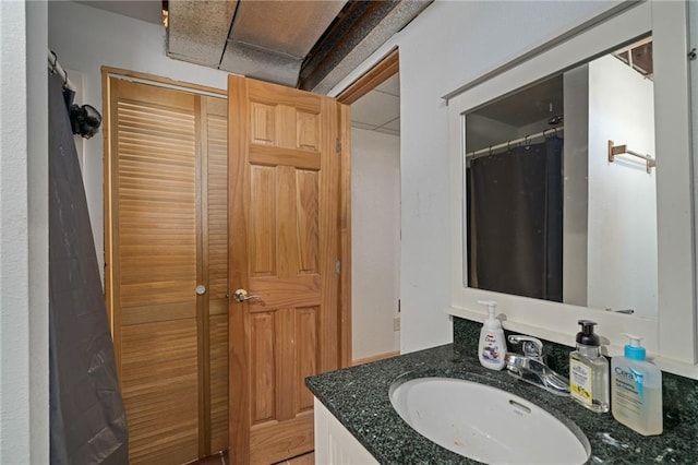 full bathroom with vanity and a shower with curtain