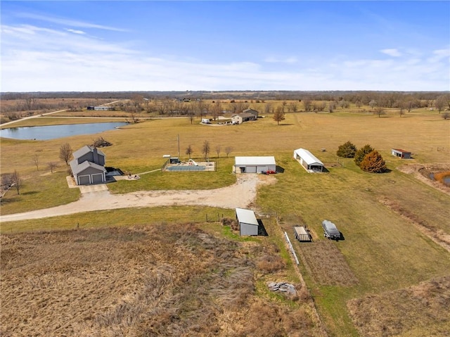 birds eye view of property featuring a rural view and a water view