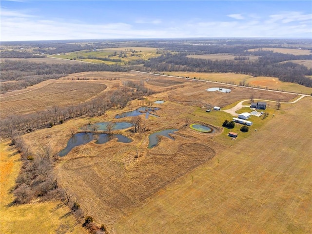 birds eye view of property with a rural view