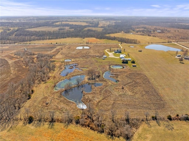 bird's eye view with a rural view and a water view