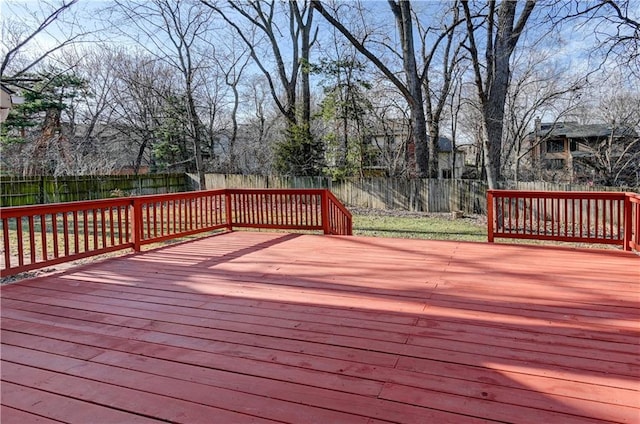 wooden deck featuring a fenced backyard