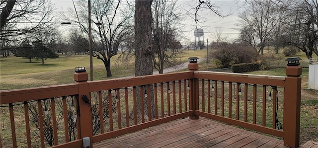 wooden terrace with a yard