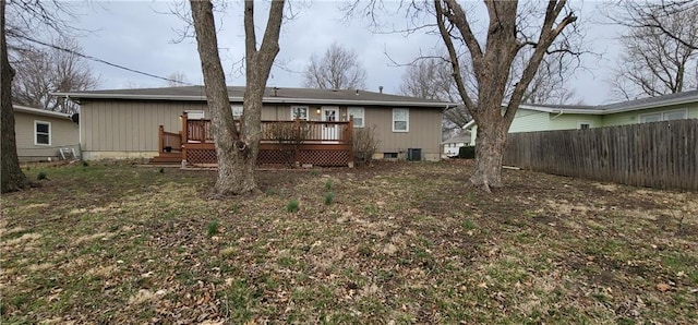 back of property featuring central AC unit, fence, and a wooden deck