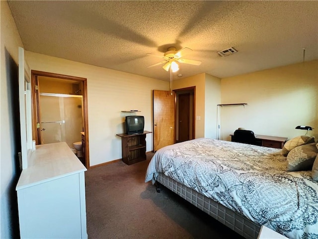 bedroom with visible vents, baseboards, ceiling fan, dark carpet, and a textured ceiling