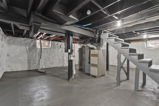 3403 Norton Ave, Kansas City, MO 64128 - below grade area with stairs, gas water heater, and heating unit