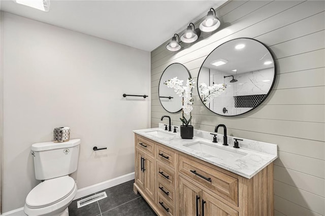 full bath with a sink, visible vents, toilet, and tile patterned flooring