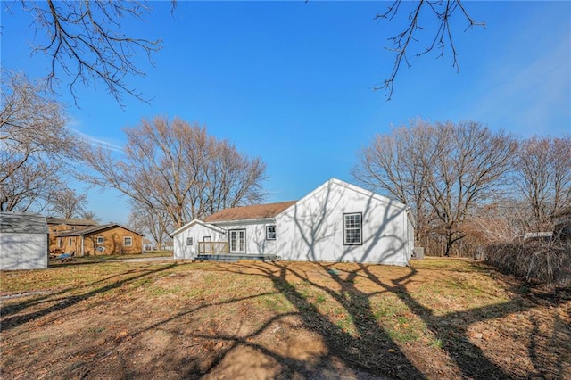 back of house with a yard