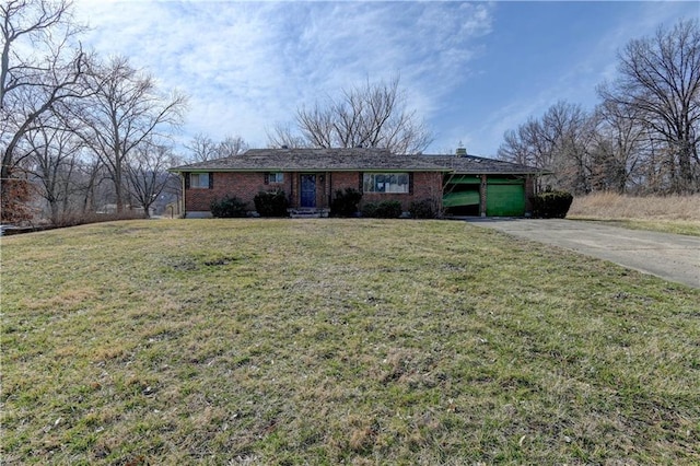 single story home featuring a carport, driveway, brick siding, and a front yard