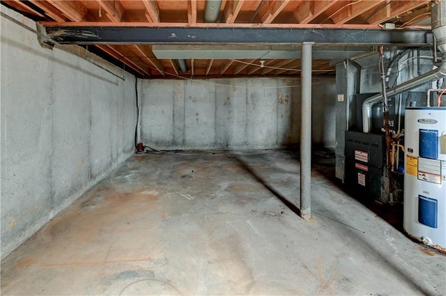 unfinished below grade area featuring electric water heater