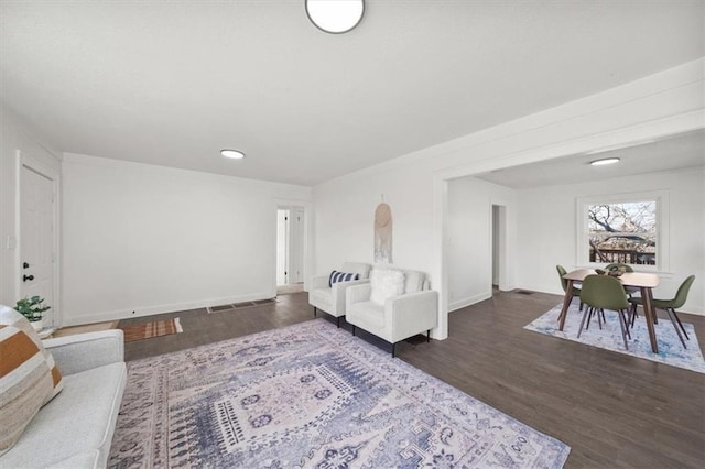 living room featuring wood finished floors and baseboards