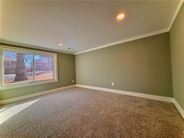 carpeted spare room featuring recessed lighting, visible vents, baseboards, and ornamental molding