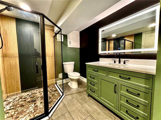 full bath with vanity, a shower stall, and toilet